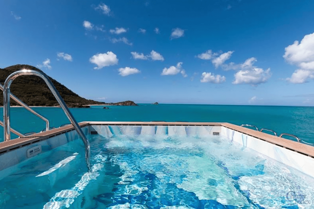hot tub next to an ocean